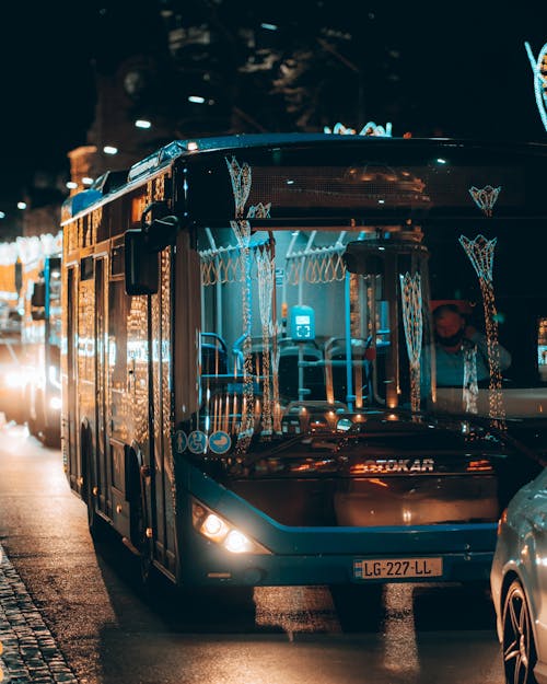 Buses on the Road During Night Time