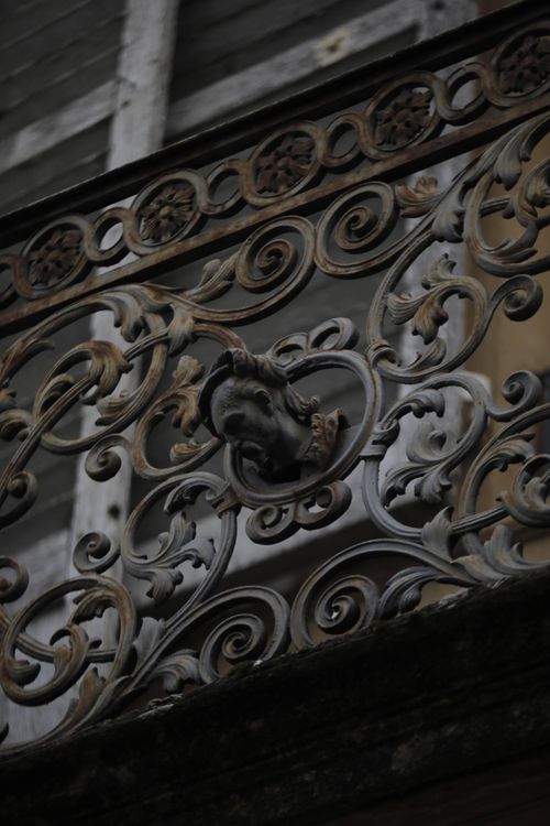 Free A detailed view of a wrought iron balcony railing showcasing intricate metalwork, located in Metz, Grand Est, France. Stock Photo