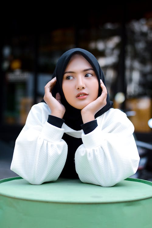 A Beautiful Hijab Woman in White Long Sleeves