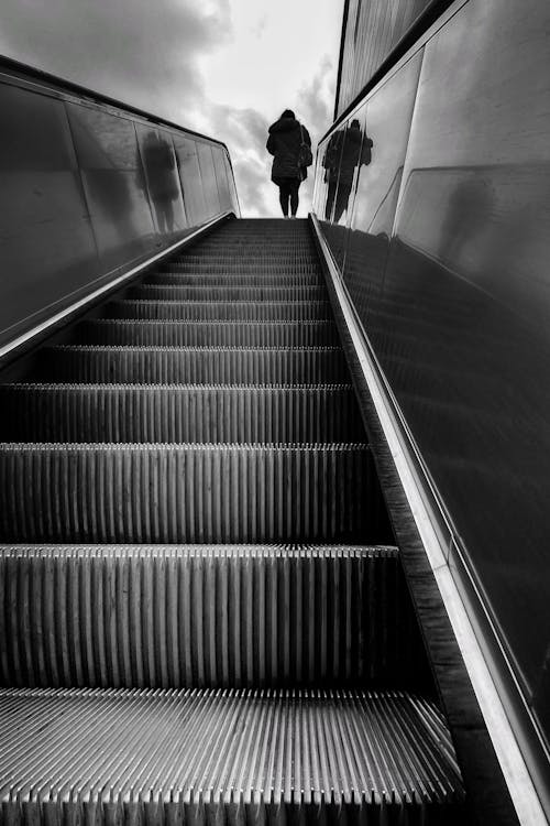 Low Angle Shot of a Person on a Escalator