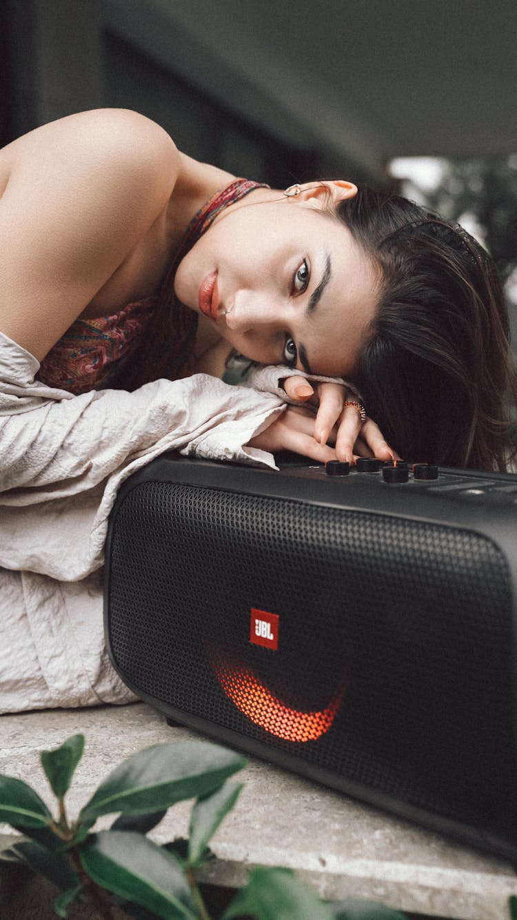 A Woman With A Speaker