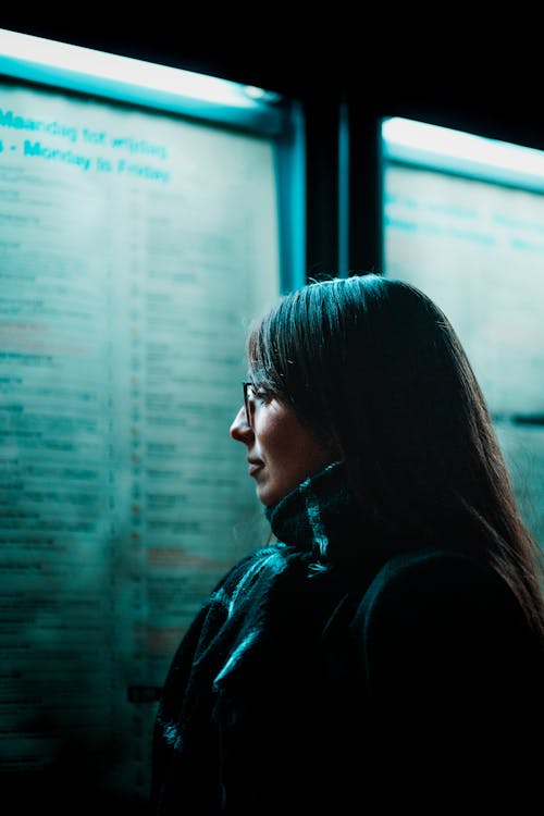 A Woman Wearing Eyeglasses and Scarf