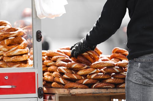 Free A Close-Up Shot of a Person Holding Loaves of Bread Stock Photo