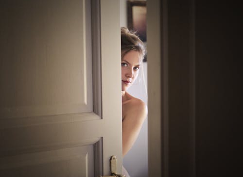 Free Photo of Woman Behind Door Stock Photo