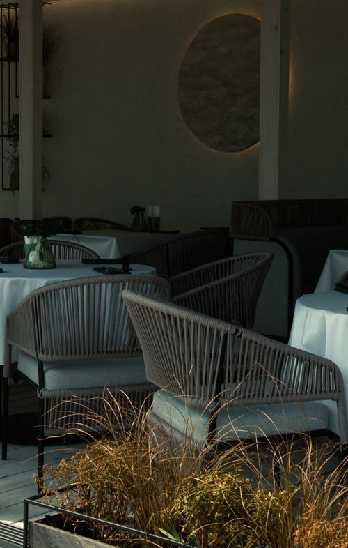 Free Inviting urban restaurant in Minsk with modern seating and elegant table settings. Stock Photo