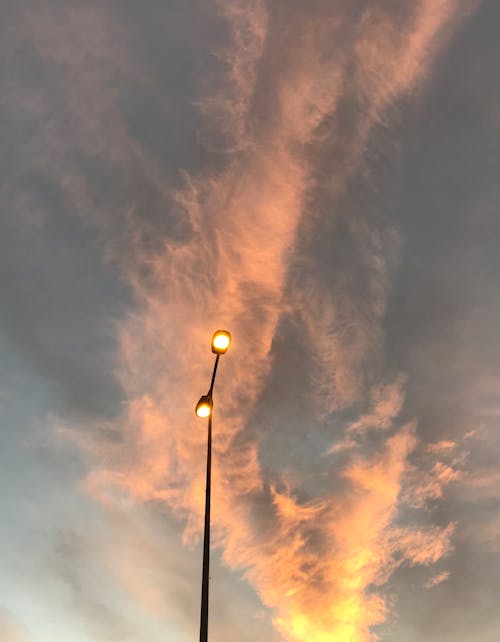 Free stock photo of cloud background, lamppost, orange background