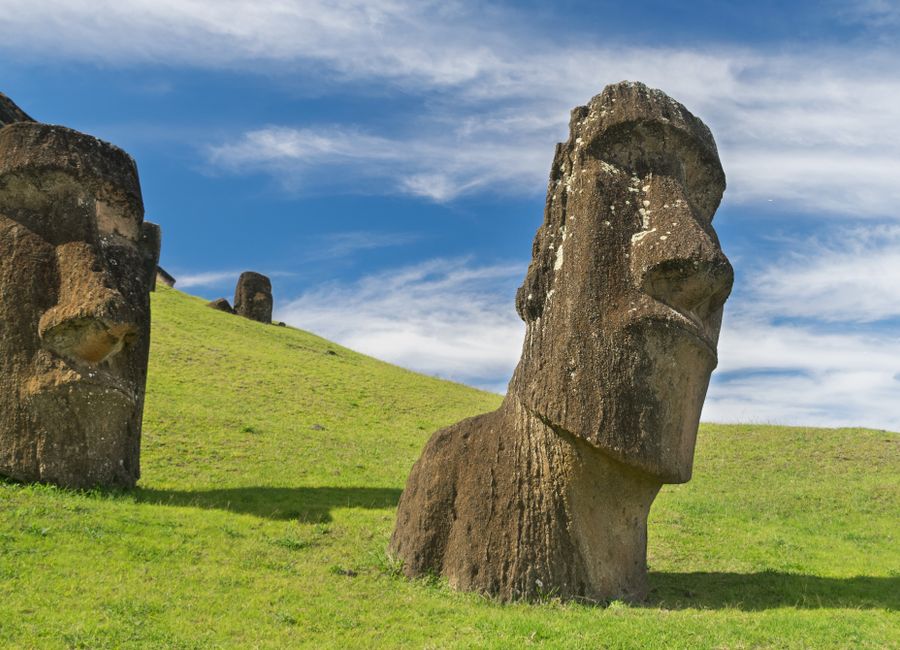 Majestic Moai statues on Easter Island with clear blue skies overhead.