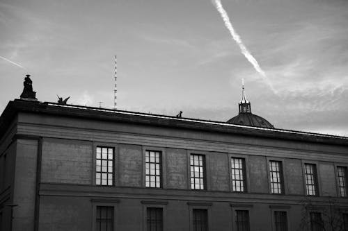Black and White Photo of a Townhouse Facade and Vapour Trail