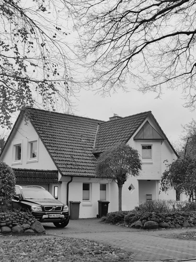 A Car Parked Beside The House