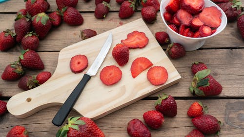 Slices of Strawberries on a Chopping Board