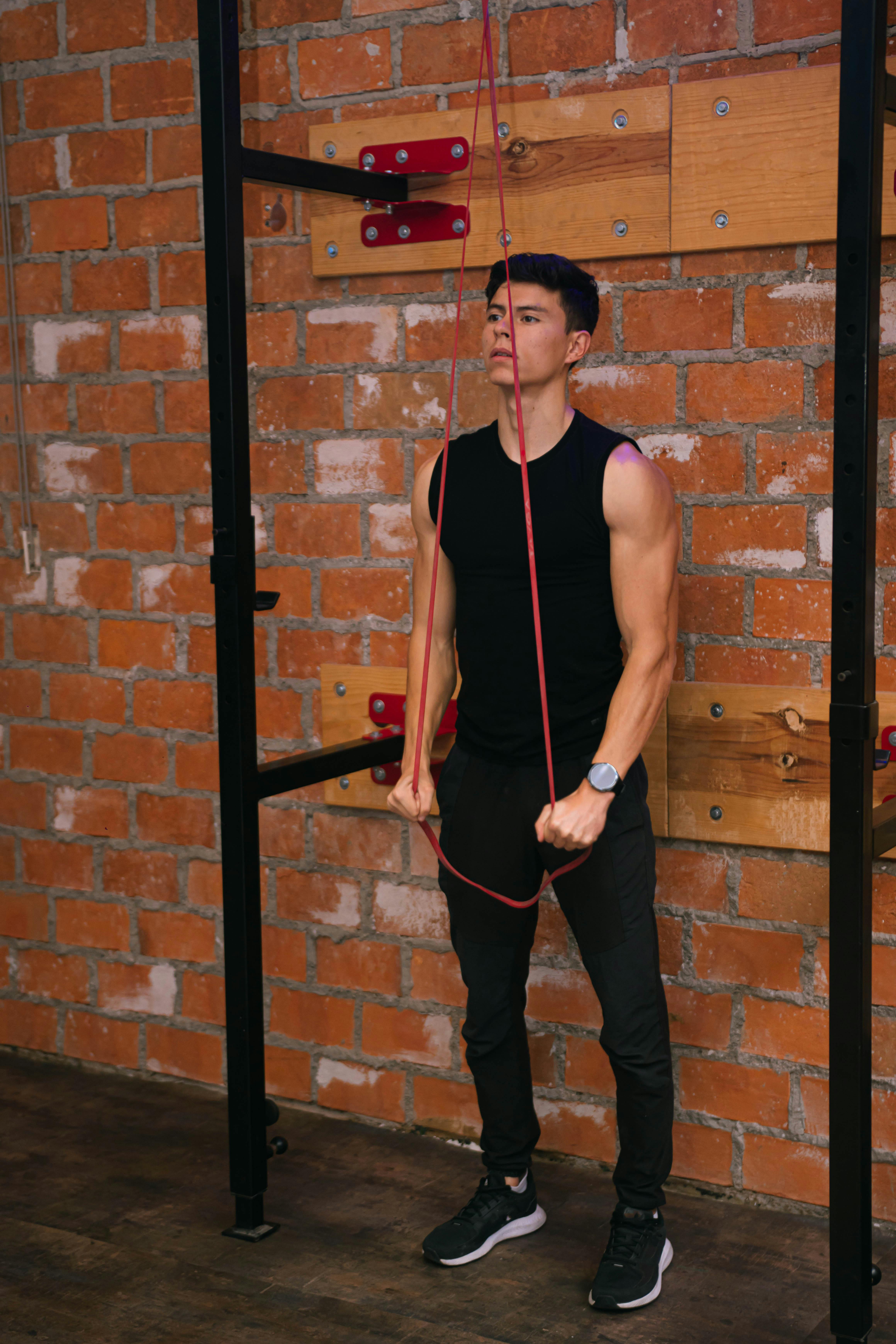 Man Stretching a Rope · Free Stock Photo