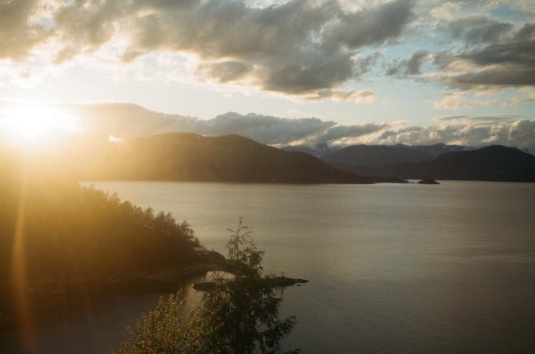 Lake In A Mountain Valley During Sunset 