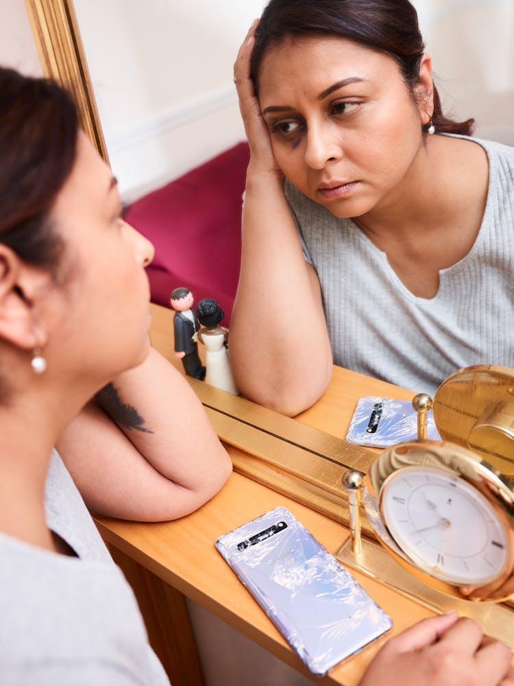 Tired Woman Looking Into Mirror