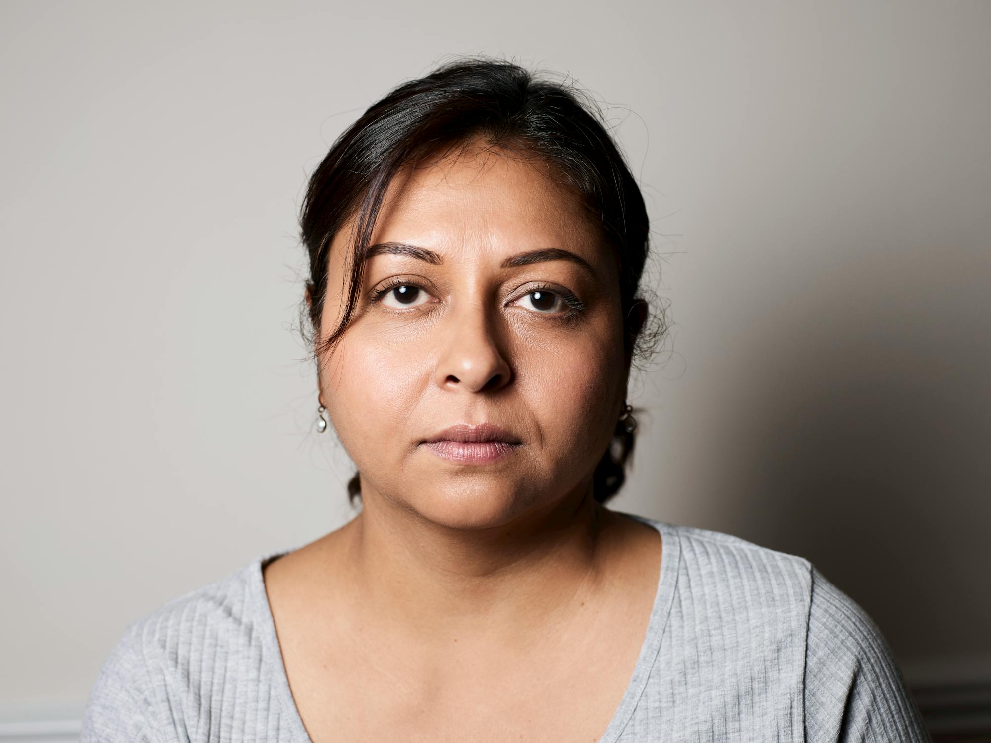 Portrait of Woman with Neutral Expression · Free Stock Photo