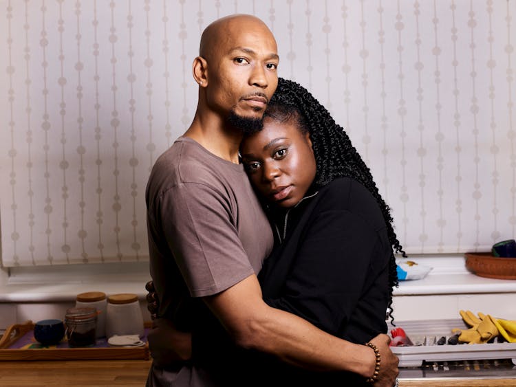 Couple Embracing In Kitchen