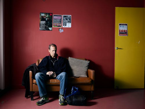 A Man Sitting in a Waiting Room