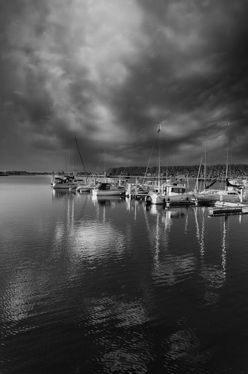Free A Grayscale Photo of Boats on the Sea Stock Photo