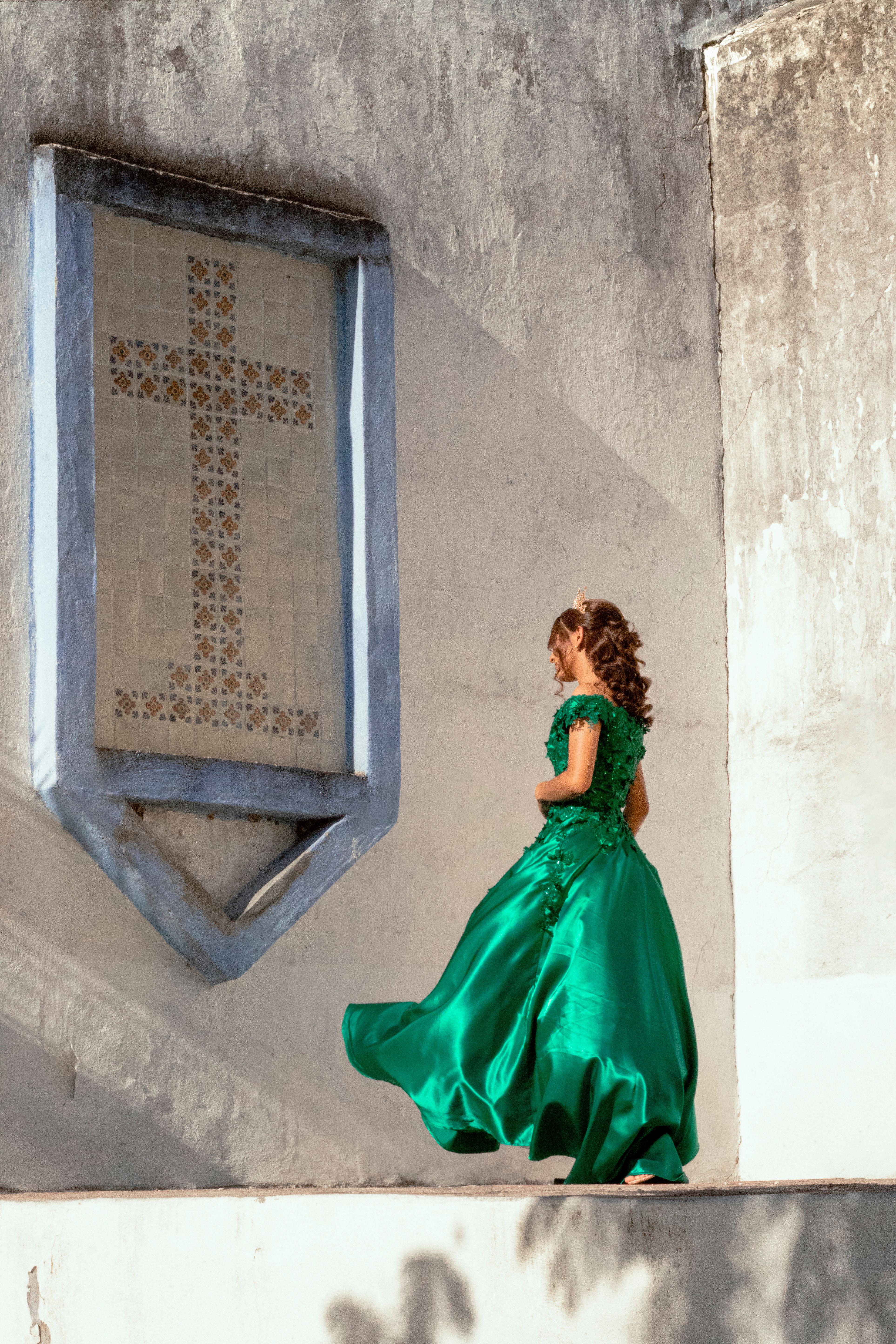 A Woman in Green Dress Standing Near the Concrete Wall · Free Stock Photo