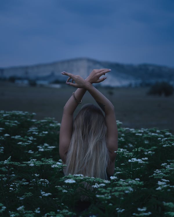 Woman in the Meadow of White Flowers 