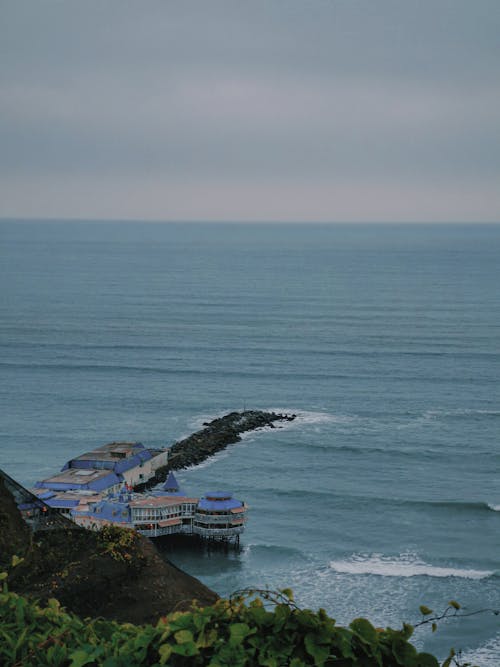 Buildings on Pier in Ocean