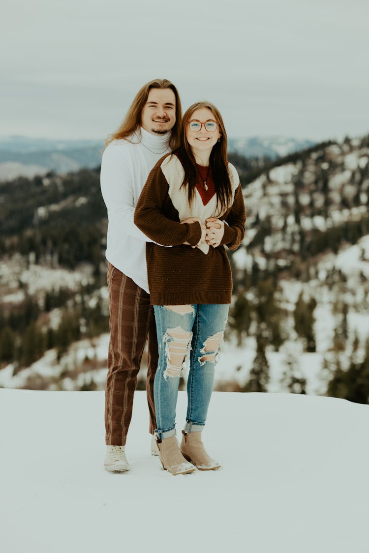 Smiling Couple On Snow