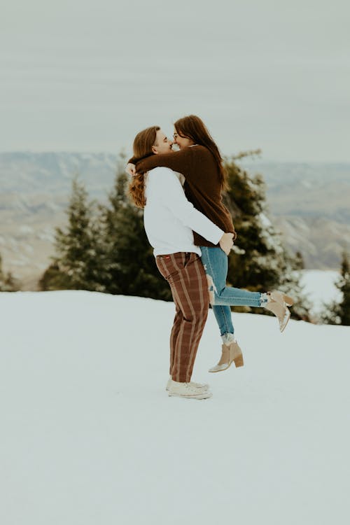 Man and Woman Hugging Each Other