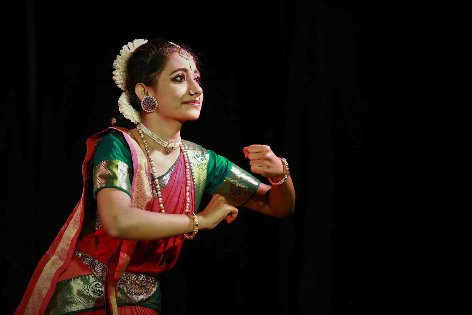 Woman practicing an energetic dance workout, illustrating Zumba's fitness-with-music concept