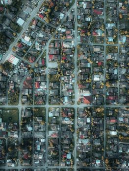 Drone shot capturing a grid-like residential neighborhood in Chukai, Terengganu, Malaysia from above.