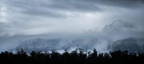 Clouds Covered Snowed Mountains