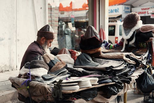 Man Selling his Merchandise in the Market 