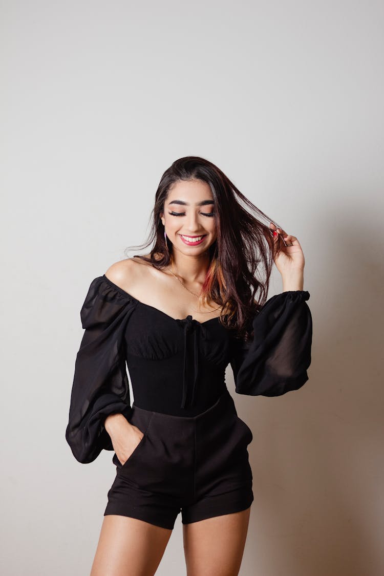 A Young Woman In A Trendy Off Shoulder Top