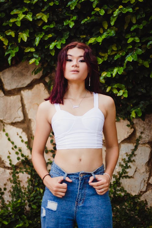 Young Woman in a Summer Outfit Outdoors 