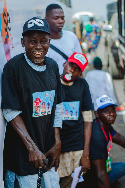 Free Group of smiling seniors at an outdoor event, promoting a positive lifestyle. Stock Photo