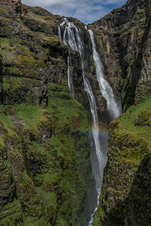 Waterfalls Under White Clouds