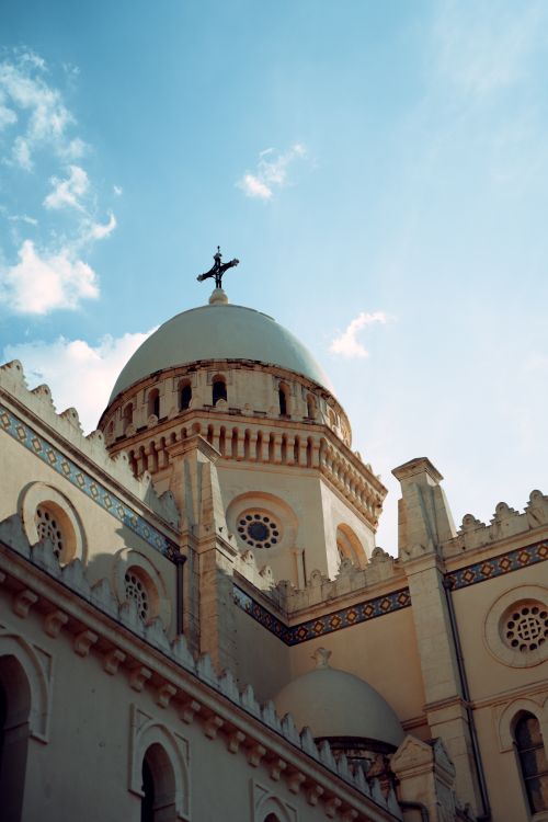 Free Beautiful low-angle shot of cathedral dome against blue sky in Annaba, Algeria. Stock Photo