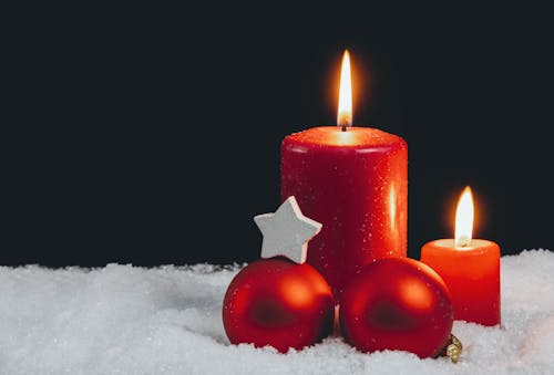 Close-up of Red Candles and Red Christmas Balls