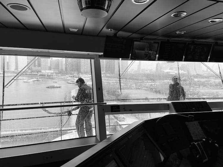 Grayscale Photo Of Men Cleaning Windows