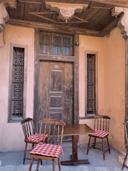 Table and Chairs in front of a Building 