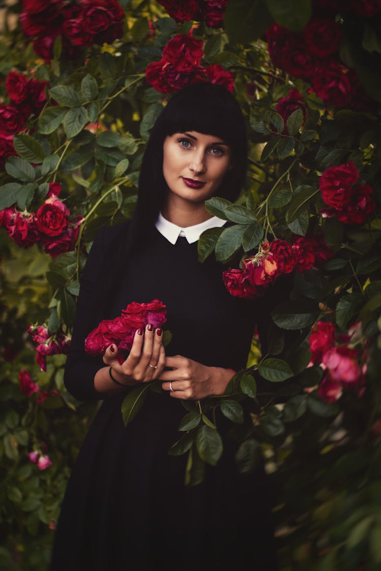 Photo Of Woman Holding Flowers