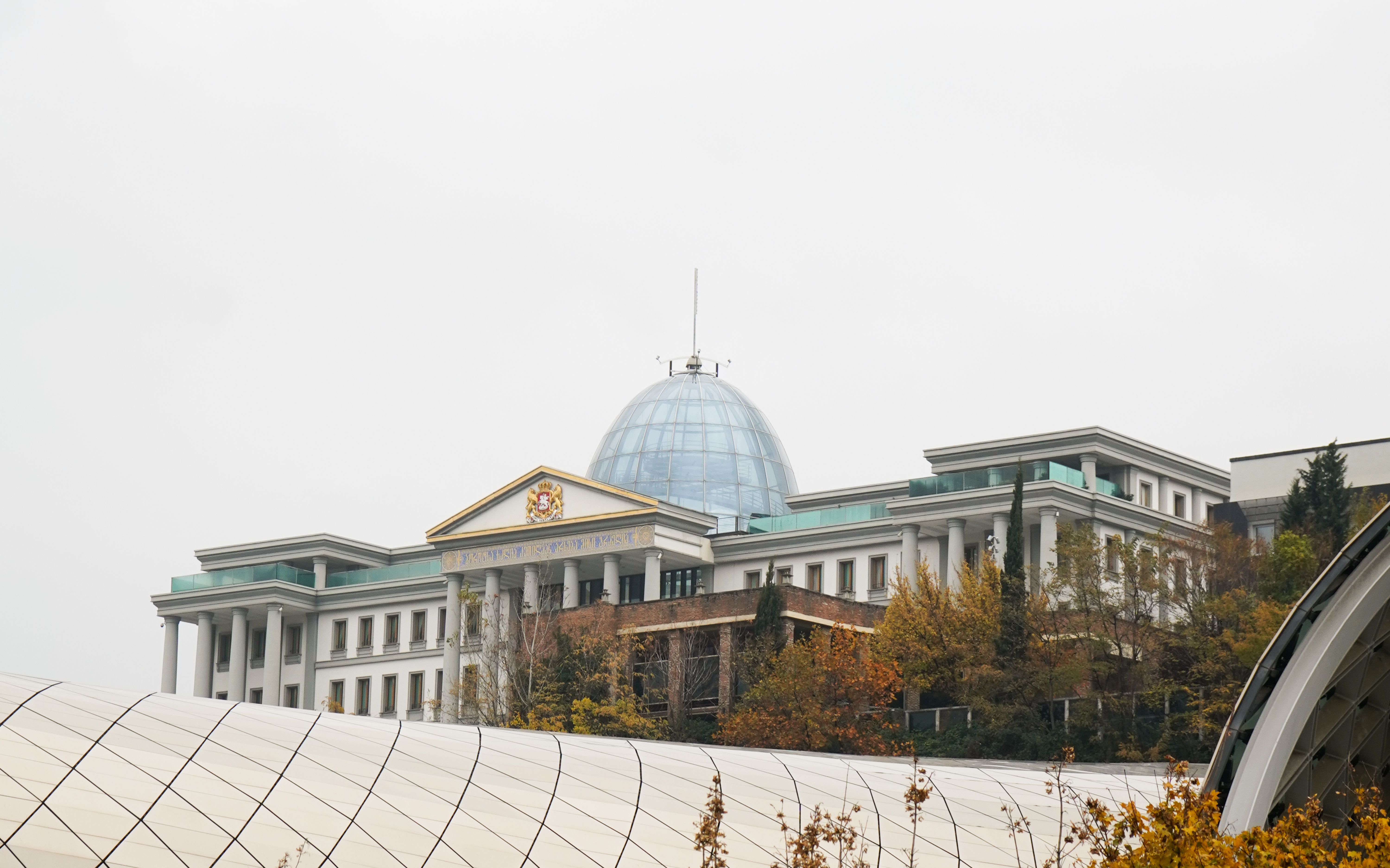 Tehran government building under overcast dusk skies