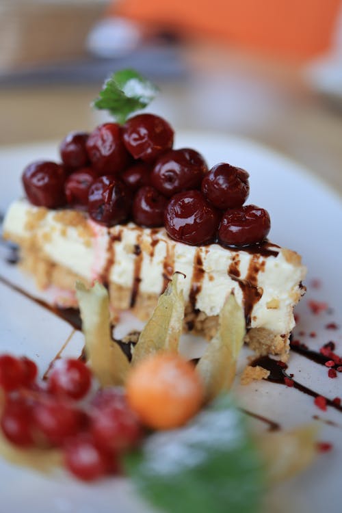 A Delicious Red Cherries Cheesecake in Close-up Shot