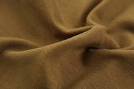 Close-Up Photo of Brown Textile