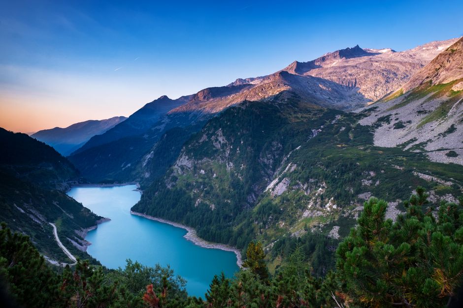 Stunning landscape of a mountain lake surrounded by peaks in Liezen, Austria.