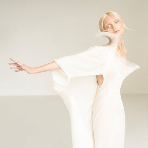 Woman Posing in White Dress