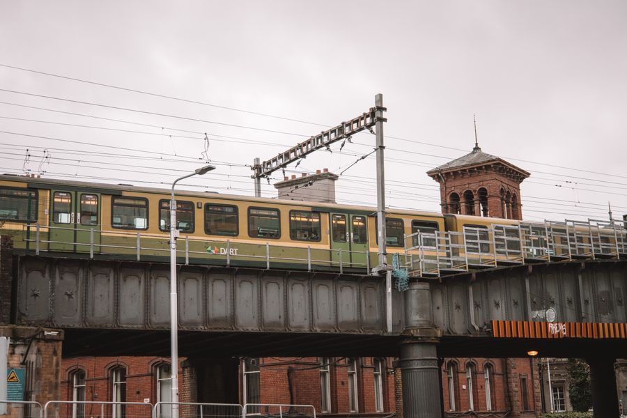 A DART train crossing a railway bridge in Dublin