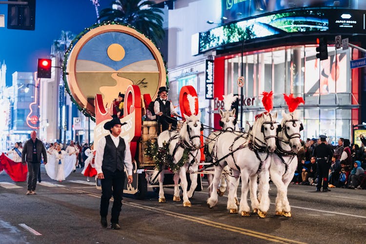 Man Riding Carriage With Horses On Street Festival