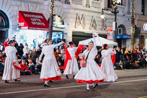 Women in Traditional Clothing Dancing in the City Street 