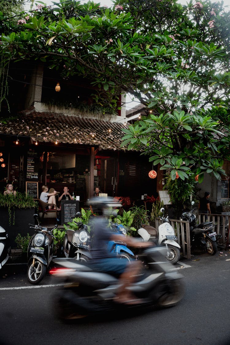 A Person Riding A Motorcycle On The Street