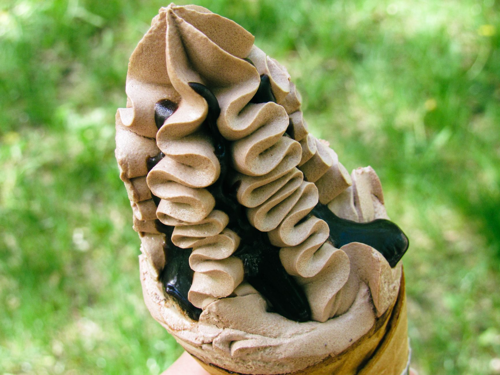 Scoops of creamy homemade chocolate ice cream in bowls