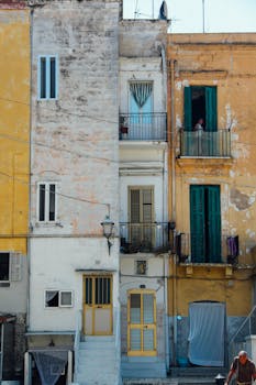 Vibrant old town architecture in Bari, Italy with colorful facades and balconies.